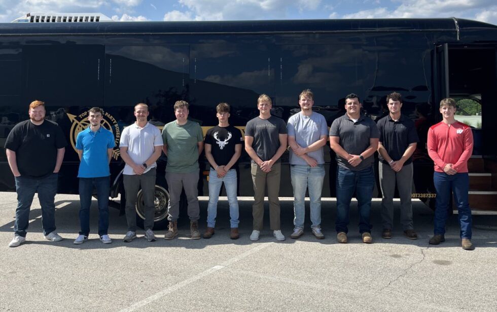Horizon summer interns in front of a bus